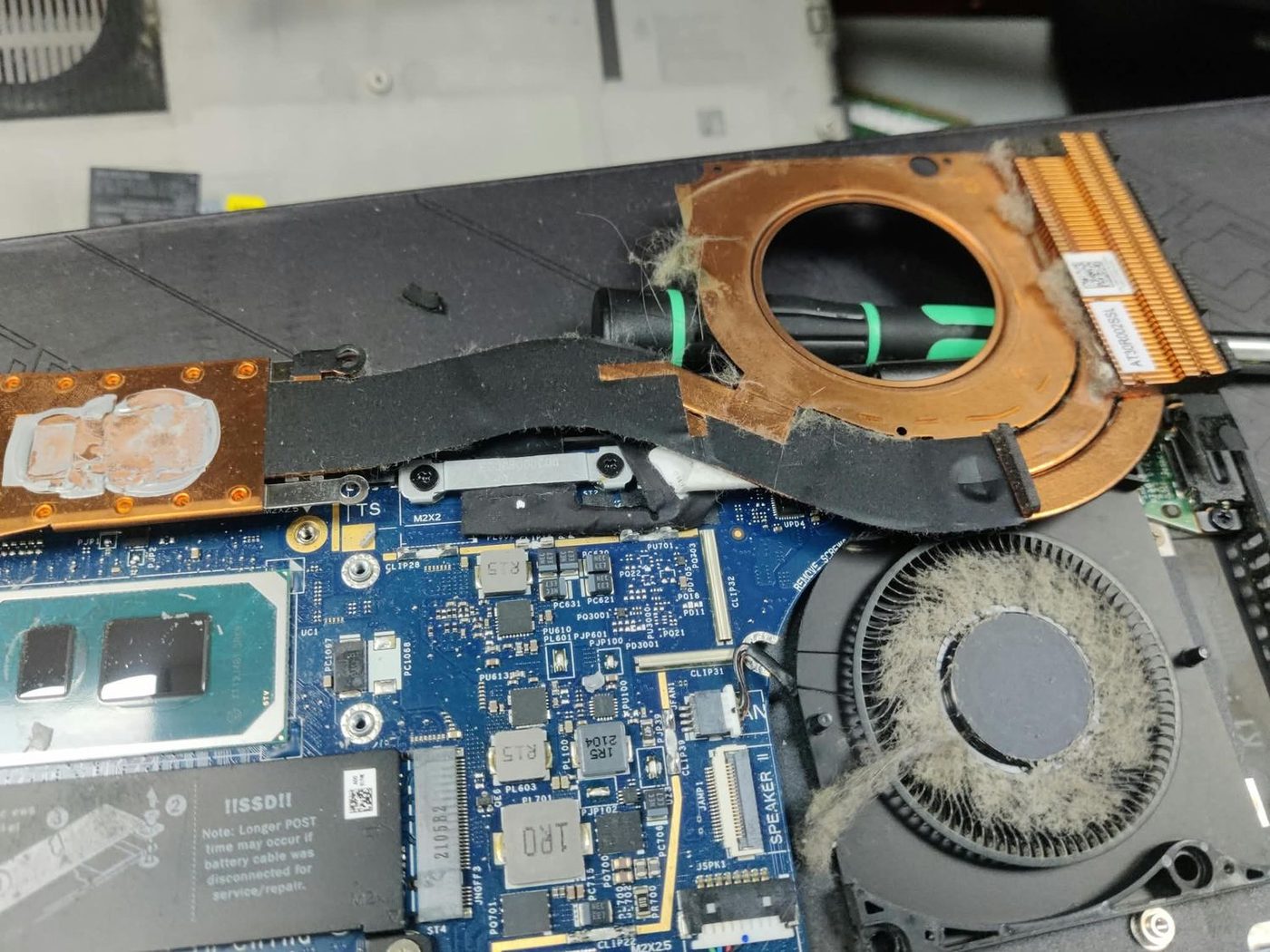 Clogged heatsink and dust-packed fan from a laptop overheating repair