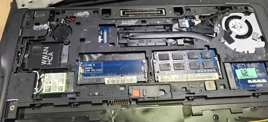 Dell Latitude service bay with memory modules and the wireless card